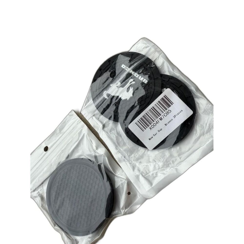 Protect your car cup holders with durable black silicone coaster pads.